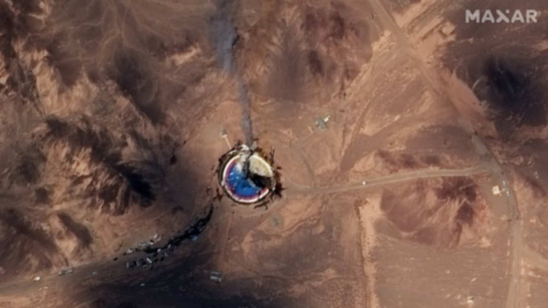 Satellite photos show burning Iran space center launch pad