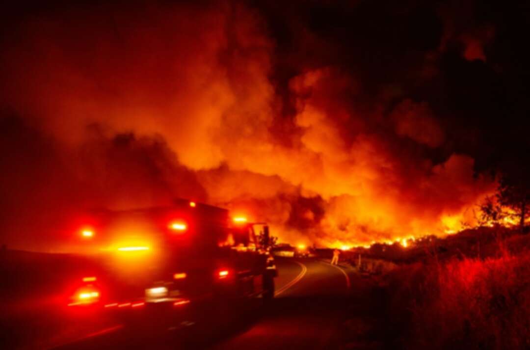 Tens of thousands evacuated as wildfires rage in California