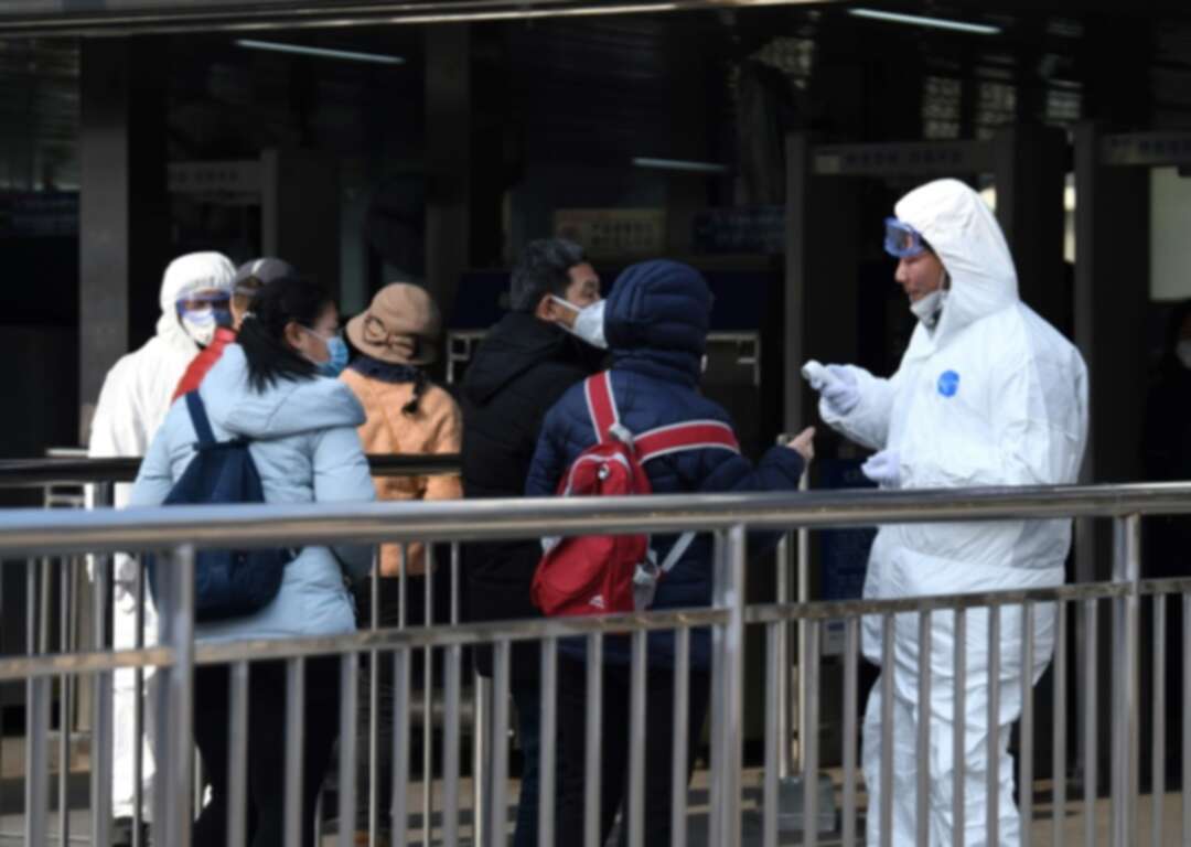 China shuts down 13 cities as virus toll climbs