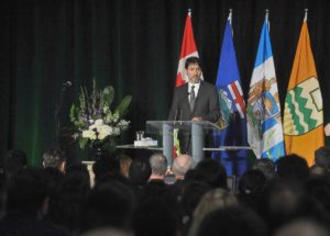 Canadian Prime Minister Justin Trudeau speaks at a memorial service for the victims of the Ukrainian Airlines flight PS752 crash in Iran at the Saville Community Sports Center in Edmonton January 12, 2020. (AFP)