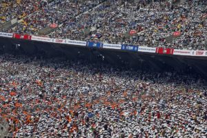 People sit in the stands at the Sardar Patel Stadium, where U.S. President Donald Trump addresses a "Namaste Trump" event with Indian Prime Minister Narendra Modi during his visit, in Ahmedabad, India, February 24, 2020. (Reuters)