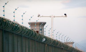 Security cameras are installed above the perimeter fence of what is officially known as a vocational skills education center in Dabancheng. (Reuters)