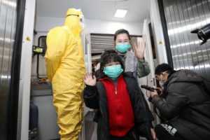 People disembarking from a Xiamen Airlines plane after arriving from the Thai capital Bangkok at Tianhe airport in Wuhan. (AFP)