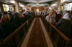 Christian Copts attend Sunday mass and listen to the priest at the Archangel Michael Church after government instructions on preventing the spread of coronavirus, in Cairo, Egypt March 15, 2020. (Reuters)