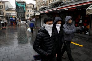 People walk in the main market in Jerusalem while Israel tightened a national stay-at-home policy following the spread of coronavirus disease in Jerusalem March 20, 2020. (Reuters)