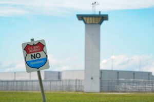 A no trespassing sign is displayed outside the federal prison complex in Terre Haute, Ind. (AP)