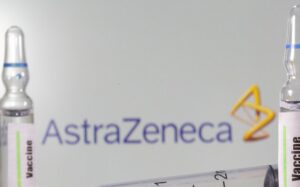 A test tube labelled with the Vaccine is seen in front of AstraZeneca logo in this illustration taken, September 9, 2020. (Reuters)