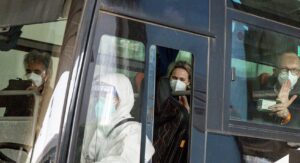 WHO team sit on a bus while leaving Wuhan Tianhe International Airport in Wuhan, Hubei province, China. (Reuters)