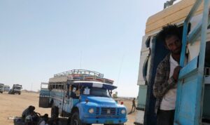 An Ethiopian refugee looks out of a bus window which transports him from the Hamdeyat refugee transit camp, which houses refugees fleeing the fighting in the Tigray region, on the border in Sudan, December 1, 2020. (File photo: Reuters)