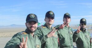 Iranian army forces flash victory signs as they pose for a picture at a large-scale Iranian army drone combat exercise in Semnan, on Iran January 4, 2021. (Iranian Army/West Asia News Agency/Handout via Reuters)