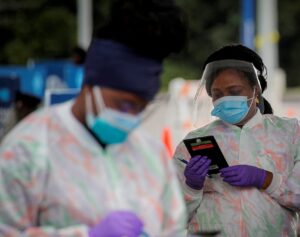 Medical technicians work at a drive-through coronavirus testing facility in New York, US September 17, 2020. (Reuters)