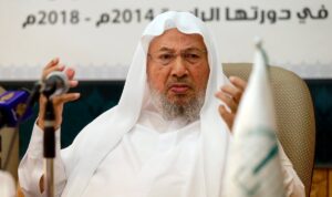 Chairman of the International Union of Muslim Scholars Yusuf al-Qaradawi (R) speaks during a news conference in Doha June 23, 2014. (Reuters)