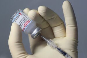 A pharmaceutical technician fills a syringe with the Moderna Covid-19 vaccine at the corona vaccination centre at the University hospital in Magdeburg, eastern Germany, on January 22, 2021. (AFP)