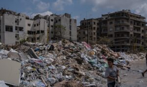 People sort through glass and rubble from the August 4 explosion on 26 August 2020 in Beirut, Lebanon. (Reuters)