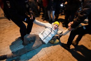 Police officers detain a man at Moscow's Vnukovo airport where Russian opposition leader Alexei Navalny is expected to arrive on January 17, 2021. (AFP)