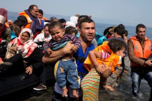 Syrian refugees arrive aboard a dinghy after crossing from Turkey to the island of Lesbos, Greece. (File photo: AP)