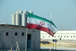 A picture taken on November 10, 2019, shows an Iranian flag in Iran's Bushehr nuclear power plant. (AFP)