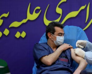 A member of the Imam Khomeini Hospital medical personnel receives a dose of Russia’s Sputnik V vaccine in Tehran. (Reuters)