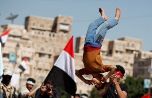 A boy displays skills during a parade held by newly recruited Houthi fighters before the fighters head to the frontline to fight against government forces, in Sanaa. (Reuters)