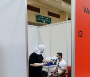 A Bahraini man waits to get a dose of a coronavirus disease (COVID-19) vaccine, at Bahrain International Exhibition & Convention Centre (BIECC), in Manama. (Reuters)