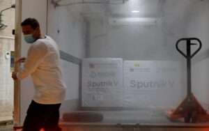 A Palestinian worker prepares to unload a shipment of Russia's Sputnik V vaccine amid the coronavirus disease (COVID-19) outbreak, in Ramallah. (Reuters)