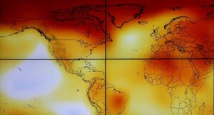 Participants are seen in silhouette as they look at a screen showing a world map with climate anomalies during the World Climate Change Conference 2015 (COP21) in Paris. (File photo: Reuters)