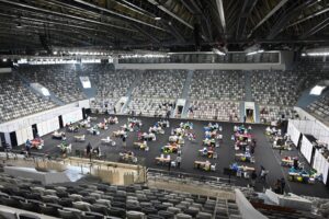 Health workers conduct a mass vaccination for the Covid-19 coronavirus at Istora Senayan stadium in Jakarta on February 4, 2021. (AP)