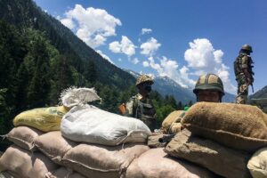 Indian Border Security Force (BSF) soldiers guard a highway leading towards Leh, bordering China, in Gagangir on June 17, 2020. (AFP)