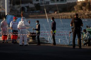 A boy has his temperature taken as he arrives with others migrants at the Arguineguin port in Gran Canaria island, Spain. (File photo: AP)