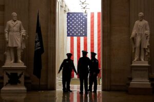 Capitol Police officers talk in the Capitol Rotunda on Capitol Hill in Washington, Monday evening, Jan. 25, 2021. (AP Photo/Susan Walsh)