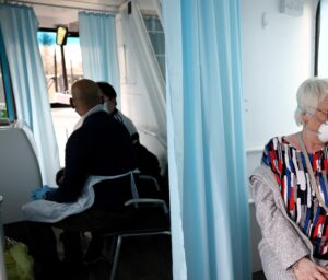 A woman receives a dose of the Oxford-AstraZeneca COVID-19 vaccine in Thamesmead, London, Britain. (Reuters)