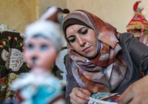 Palestinian Hanan Al-Madhoon makes decorations for sale ahead of the holy fasting month of Ramadan, at Beach refugee camp in Gaza City. (Reuters)