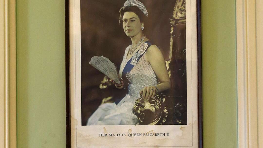 A group of Oxford University students replace the Queen's portrait with other influential people