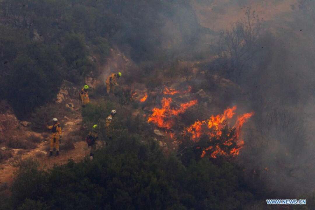 Three people have been arrested for suspected arson as devastating wildfires rage in Greece