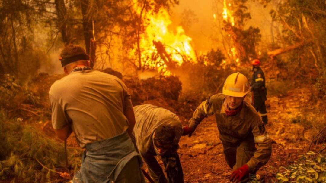 Greece's prime minister apologises as the island of Evia still facing huge blazes