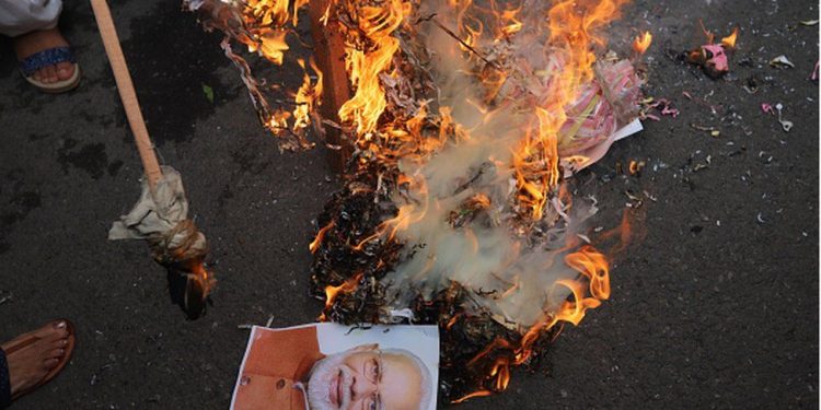 Protesters have burnt effigies of PM Narendra Modi 