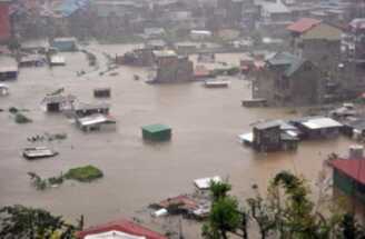 A general view shows houses submerged by flooding due to heavy rains brought by Typhoon Megi in Baguio City, Benguet province, north of Manila on October 19, 2010. (Xinhua/AFP Photo)