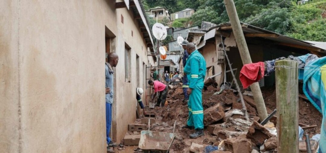 Residents salvage the remains of what use to be the United Methodist Church of South Africa in Claremont, near Durban ( File photo AFP)