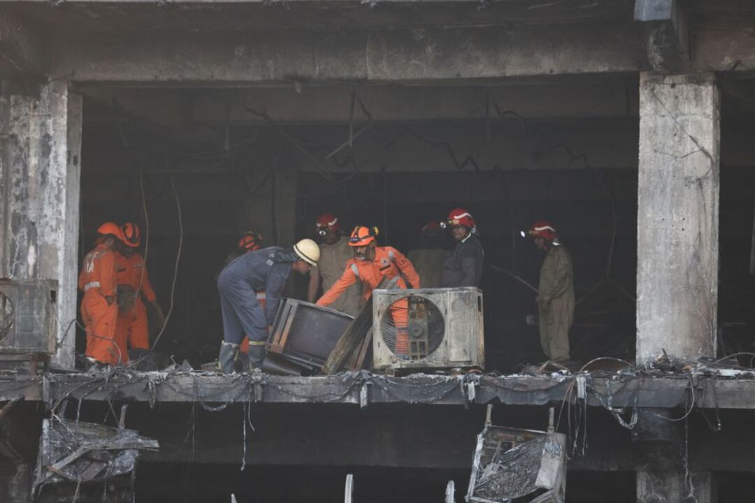 Building fire kills 27 in New Delhi, police arrest company owners